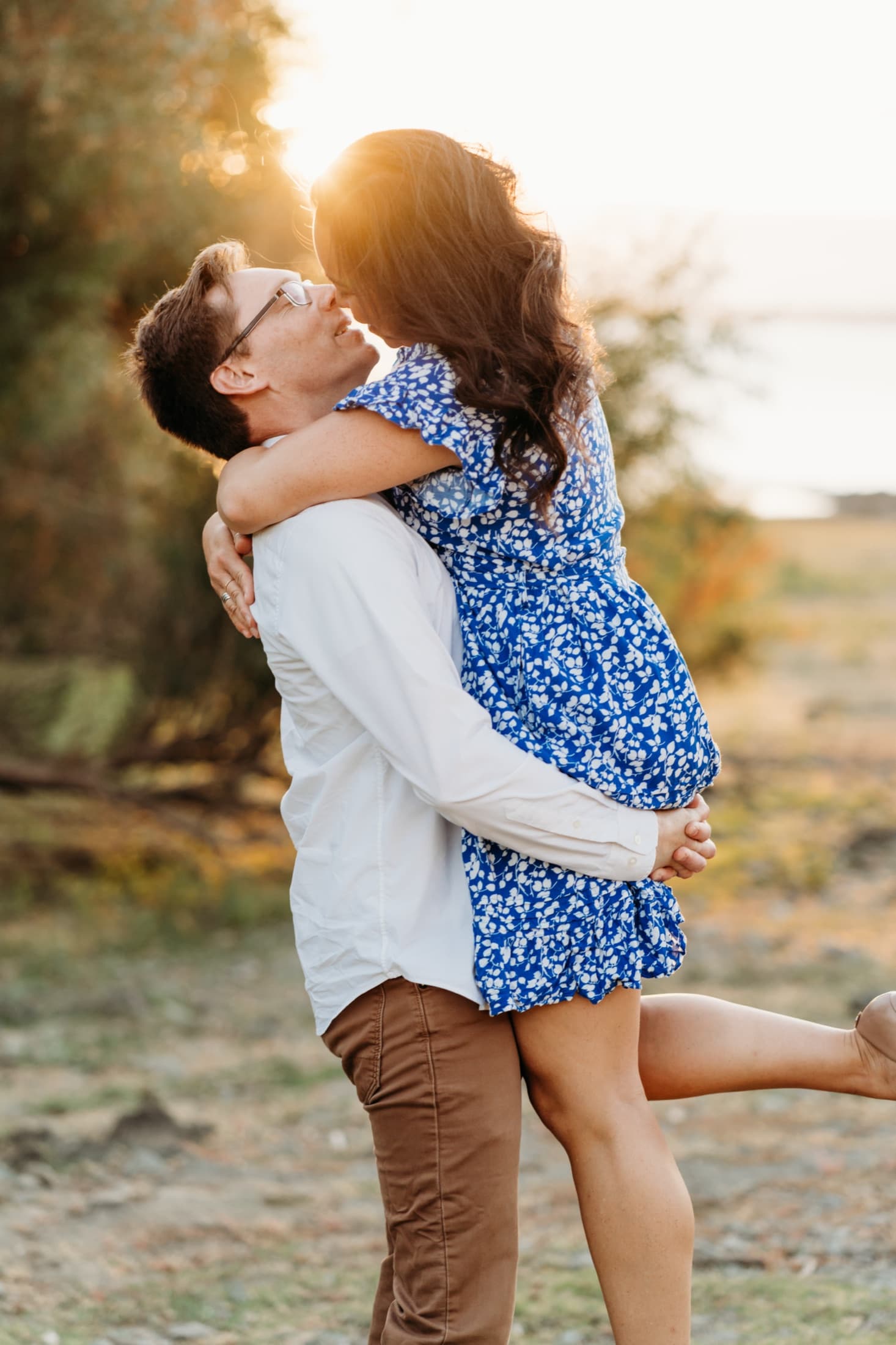 Couple laughing mid-lift