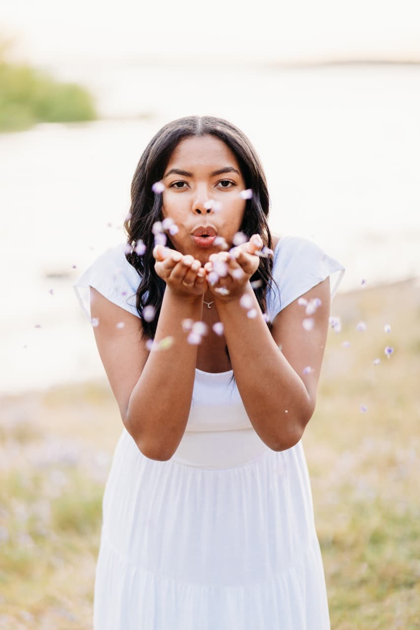 Senior portrait with flower petals