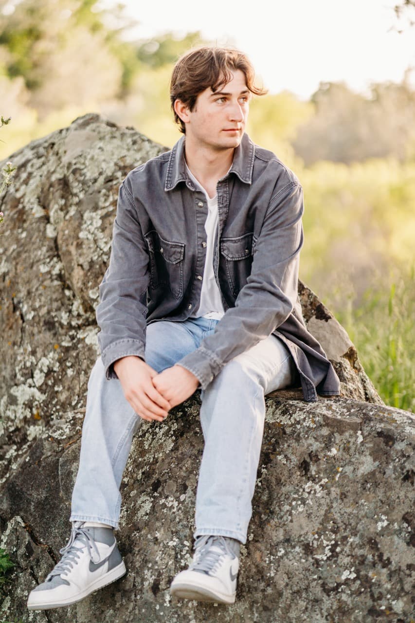 Senior portrait on a granite boulder